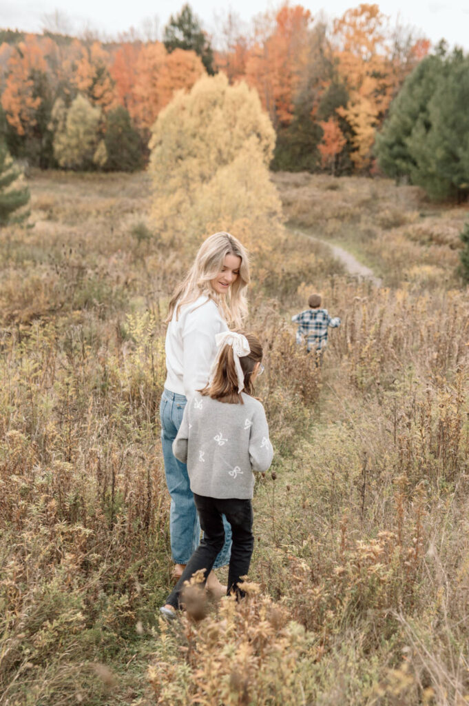 Fall family photography session in Bolton Ontario with colourful autumn leaves